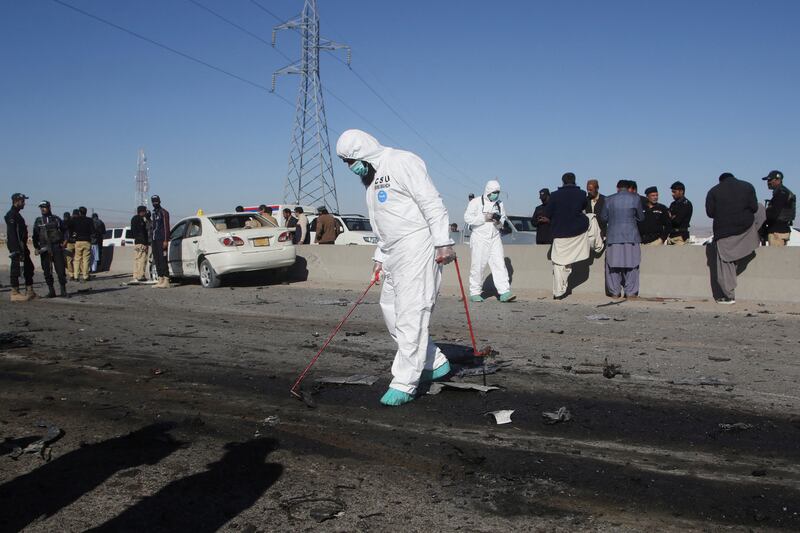 A crime scene unit surveys the site in Quetta. Reuters