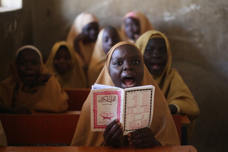 A girl recites Islamic texts at a school in Maiduguri, north-eastern Nigeria, where there is optimism that life is slowly returning back to normal after a 12-year terrorist insurgency. EPA
