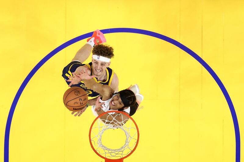 Brandin Podziemski of the Golden State Warriors and R J  Hampton of the Miami Heat contest a rebound at Chase Centre in San Francisco, California. Getty Images