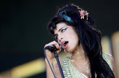 FILE PHOTO: British singer Amy Winehouse performs during the "Rock in Rio" music festival in Arganda del Rey, near Madrid, July 4, 2008. REUTERS/Juan Medina/File Photo