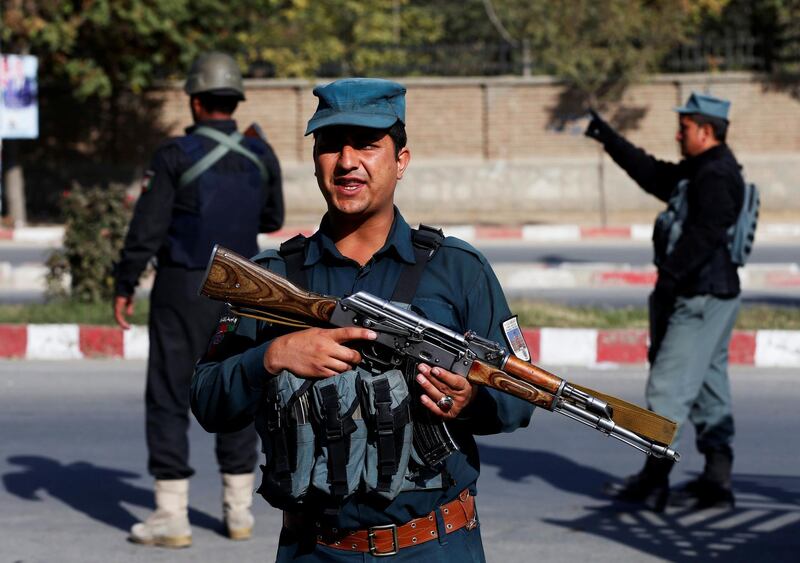 Policemen stand guard at a checkpoint in Kabul. Reuters