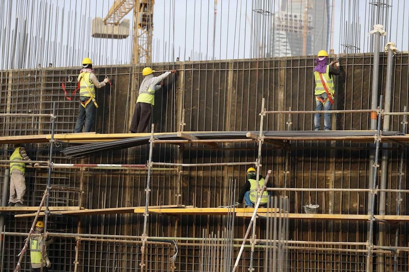 Indian labourers work at the construction site of a building in Riyadh. Thousands of laid-off Indian workers in the kingdom and Kuwait face food crisis, says India's government. Faisal Al Nasser / Reuters 