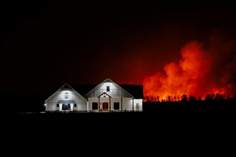 A wildfire that prompted an evacuation edges towards a home outside of Shattuck, Oklahoma. Reuters
