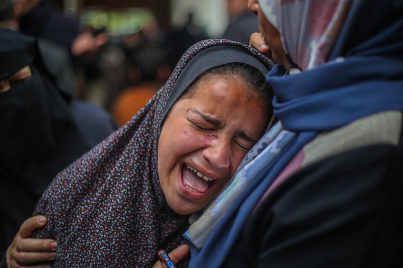 A mourner cries as the dead bodies of victims are received in Rafah, where hospitals say their morgues are full. Getty Images
