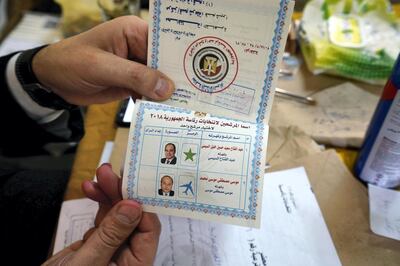 March 27, 2018 -- Cairo-- A judge displays the ballot at a polling station in Shubra.  (Dana Smillie for The National)