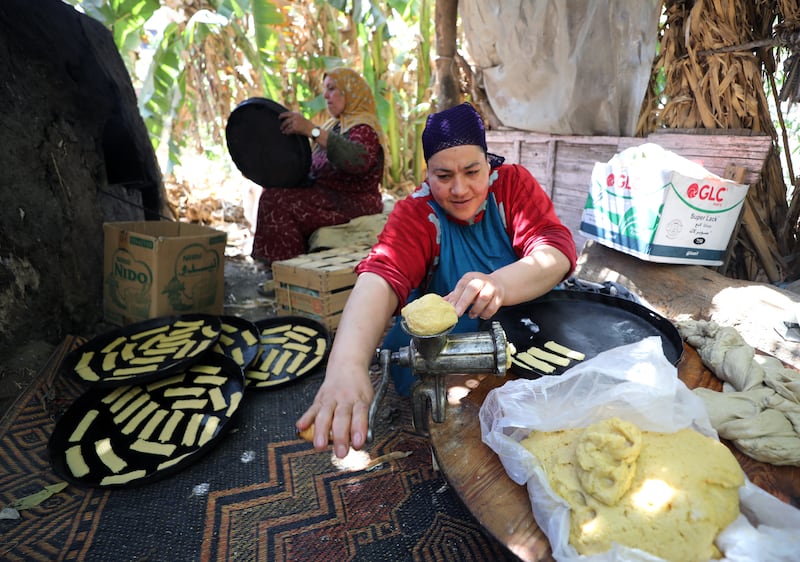 An Egyptian woman prepares bread on the outskirts of Cairo in the run-up to Eid Al Fitr EPA 