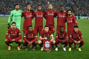 Liverpool's Brazilian goalkeeper Alisson Becker, Liverpool's Brazilian midfielder Fabinho, Liverpool's English defender Joe Gomez, Liverpool's Dutch defender Virgil van Dijk, Liverpool's Belgium striker Divock Origi and Liverpool's Egyptian midfielder Mohamed Salah on the back row and Liverpool's English defender Trent Alexander-Arnold, Liverpool's Dutch midfielder Georginio Wijnaldum, Liverpool's English midfielder James Milner, Liverpool's Guinean midfielder Naby Keita and Liverpool's English midfielder Alex Oxlade-Chamberlain line up ahead of the UEFA Champions League group E football match between Liverpool and RC Genk at Anfield in Liverpool, north west England on November 5, 2019. / AFP / Oli SCARFF
