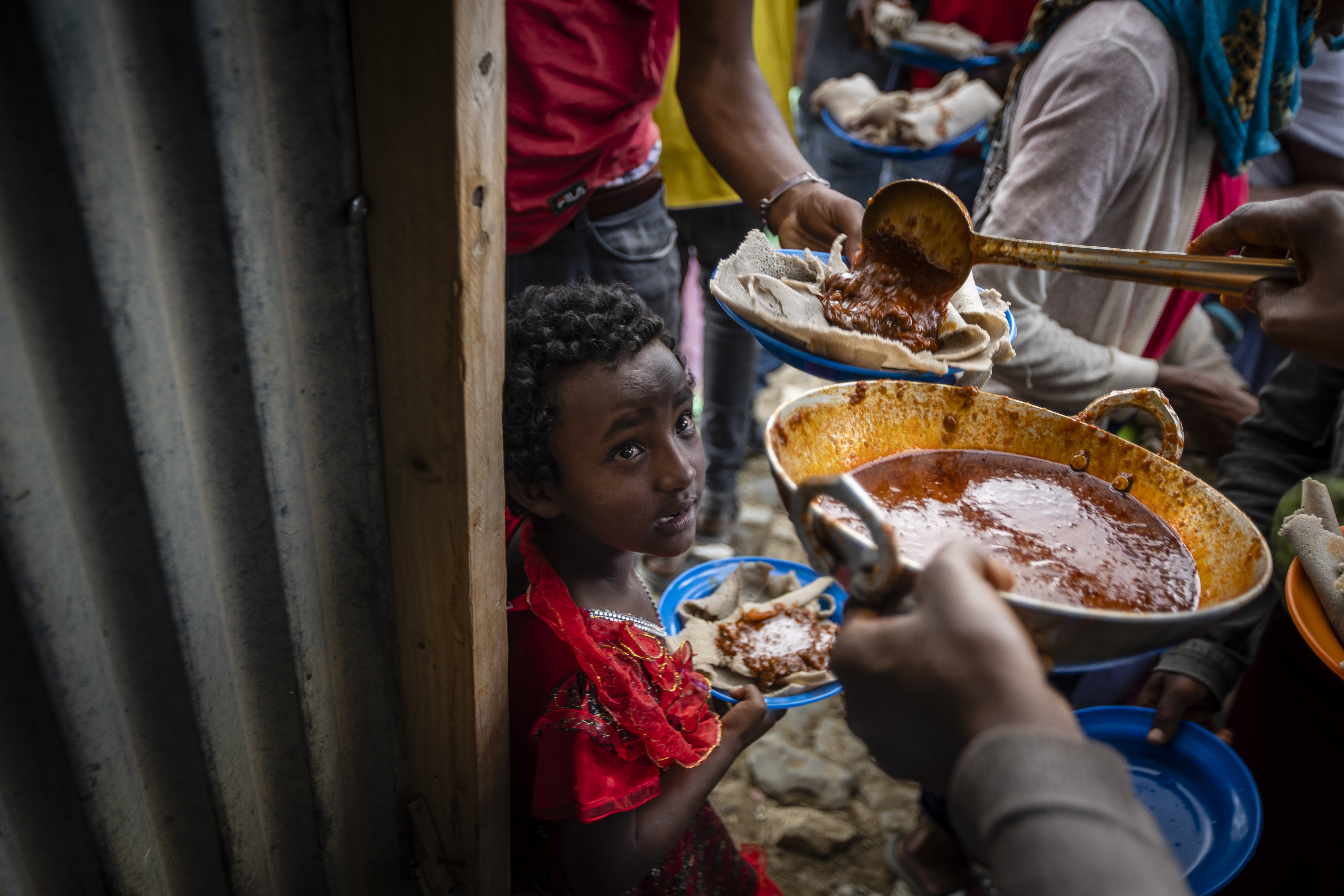 Displaced Tigrayans line up to receive food in northern Ethiopia. AP