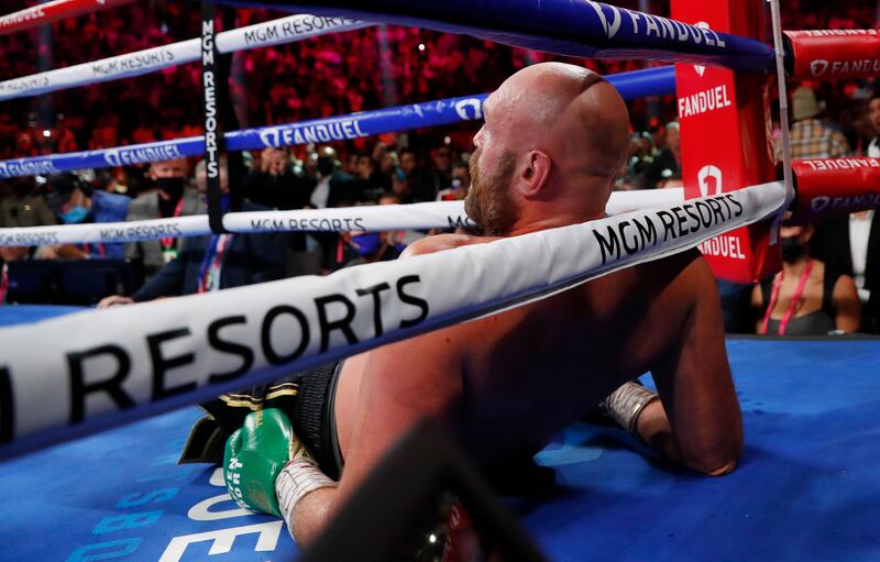Tyson Fury reacts after being knocked down by Deontay Wilder. Reuters