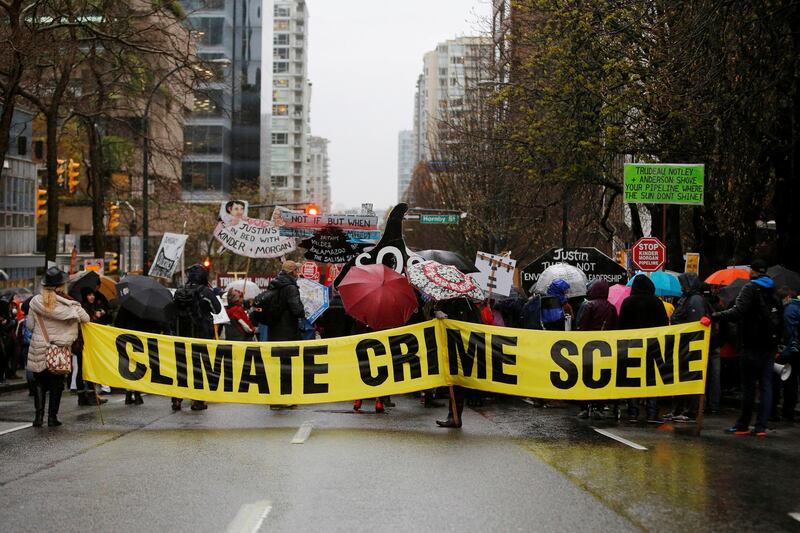 FILE PHOTO: Opponents of the Kinder Morgan oil pipeline protest outside Liberal Party fundraising event in Vancouver, British Columbia, Canada, April 5, 2018.  REUTERS/Ben Nelms/File Photo