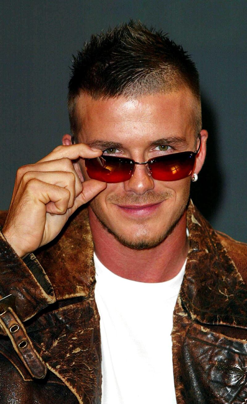 (FILE PHOTO) Former Manchester United, Real Madrid, LA Galaxy, AC Milan, Paris Saint Germain and England midfielder David Beckham has announced his retirement from football at the end of the season 7 Feb 2002:  Manchester United star and England captain David Beckham poses for photographs at the launch of the new range of Police sunglasses in London, England. Mandatory Credit: Allsport UK/Getty Images *** Local Caption ***  1574708.jpg