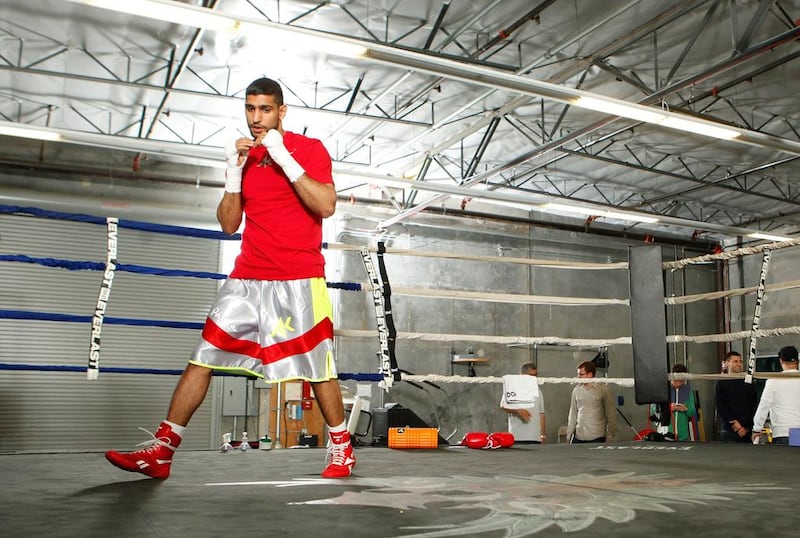 Amir Khan in action during a workout session at Virgil Hunter’s Gym on April 24, 2014 in Hayward, California. Kahn is preparing to take on Luis Collazo at the MGM Grand in Las Vegas on May 3, 2014. Alexis Cuarezma/Getty Images/AFP