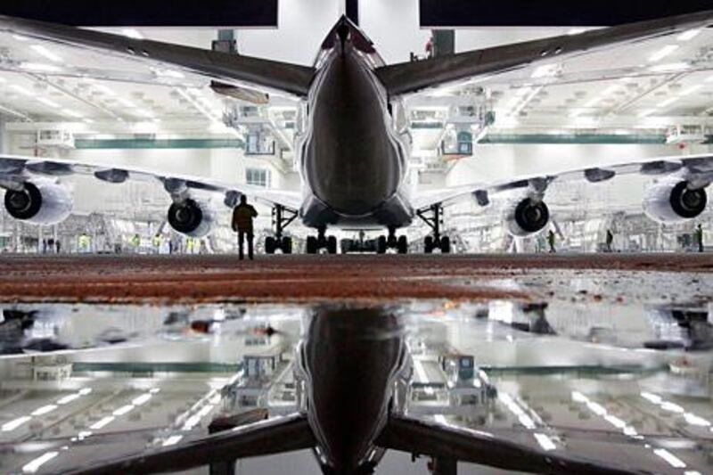 A new Airbus A380 airliner for Lufthansa leaves the paintshop hangar at the Airbus facility in Finkenwerder near Hamburg February 5, 2010. The first A380 aircraft for Deutsche Lufthansa AG is named 'Frankfurt am Main' and will be delivered later this year. Picture taken February 5, 2010.  REUTERS/Christian Charisius  (GERMANY - Tags: TRANSPORT SCI TECH IMAGES OF THE DAY) *** Local Caption ***  CHA200_GERMANY-_0206_11.JPG