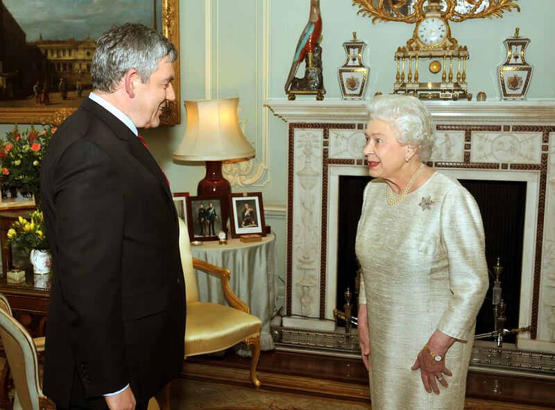 The queen greets Gordon Brown at the palace in 2010. After five days of negotiations, a Conservative and Liberal Democrat coalition government was confirmed, with Mr Brown resigning as PM. Getty Images