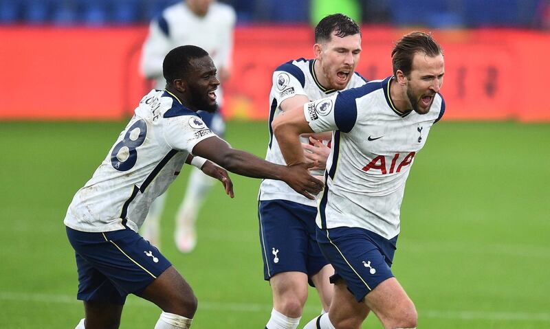 Tottenham Hotspur striker Harry Kane, right, celebrates after scoring the opener. AFP