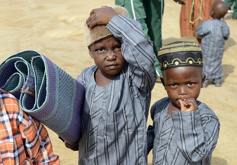 Muslim boys arrive with a prayer mat at the Isa Kazaure praying ground in Nigeria’s central city of Jos to mark Eid Al Fitr, the end of the Muslim fasting month of Ramadan. Pius Utomi Ekpei / AFP photo