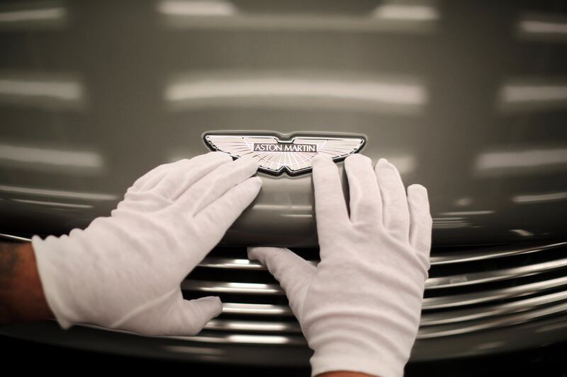 An Aston Martin Vanquish is inspected by hand at the company headquarters and production plant in 2013, Gaydon.