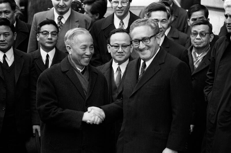 Mr Kissinger with Le Duc Tho, leader of North Vietnamese delegation, after signing a ceasefire agreement in the Vietnam War, in January 1973, in Paris. AFP