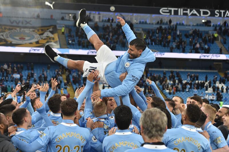 Sergio Aguero is thrown in the air by Manchester City teammates after his last home match for the club against Everton at the Etihad Stadium on Sunday, May 23. EPA