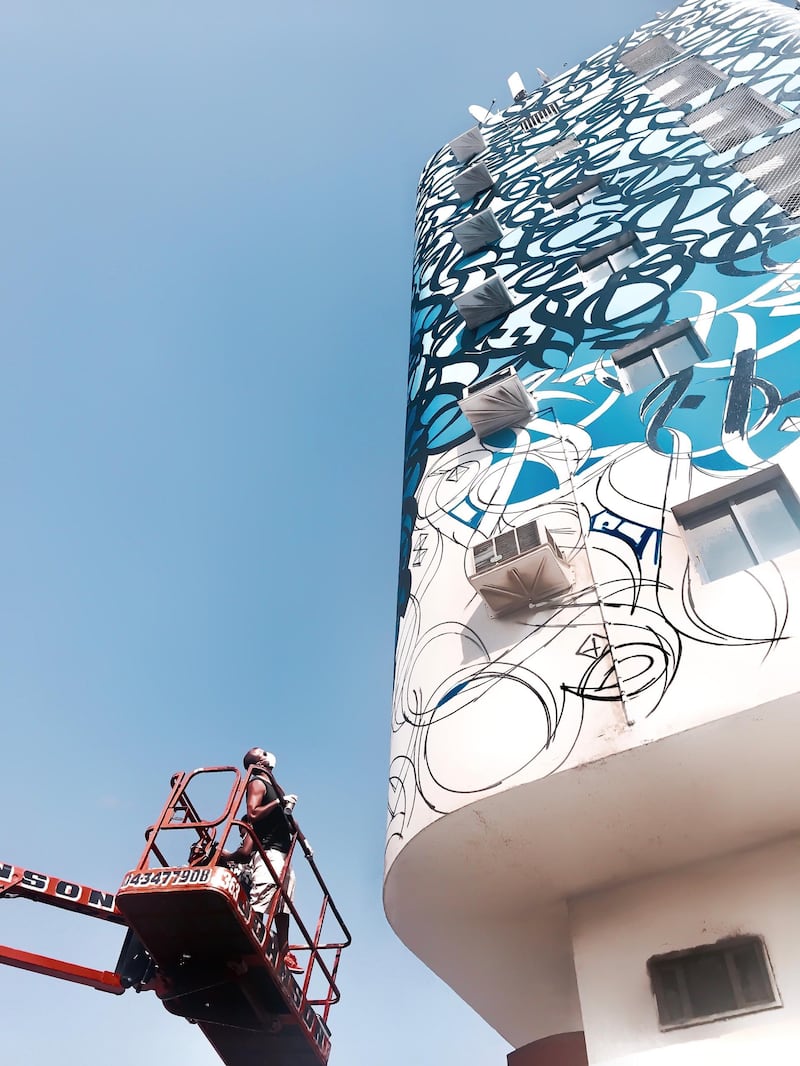 Ajman, UAE: ‘Les Yeux Dan Les Bleus’, on the Al Bustan Building in Ajman, is based on a poem by Sheikh Zayed, the Founding Father. Speaking of completing the 2017 work, eL Seed says: 'I painted it during Ramadan, so it was super-difficult. I tried before iftar, after iftar, early in the morning before suhoor … but then I just decided to pause, and start again after Ramadan.' Courtesy eL Seed