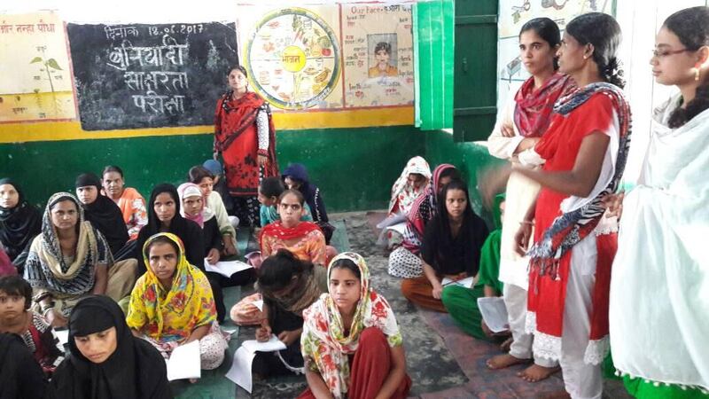 Women in Badagon village in Utter Pradesh take part in free literacy classes. Courtsey Kidwai family