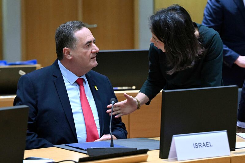 Israeli Foreign Minister Israel Katz talks with German counterpart Annalena Baerbock during a meeting at the EU's headquarters in Brussels on Monday. Mr Katz was later criticised for bringing up the topic of building an artificial island off the coast of Gaza during discussions. AFP
