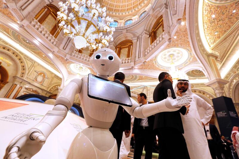 A robot welcomes participants to the Future Investment Initiative forum, "FII" during the opening session in Riyadh, Saudi Arabia. AP Photo