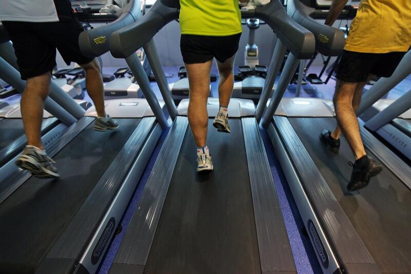 Runners keep pace on treadmills at Fitness First health club in Dubai. Amy Leang/The National