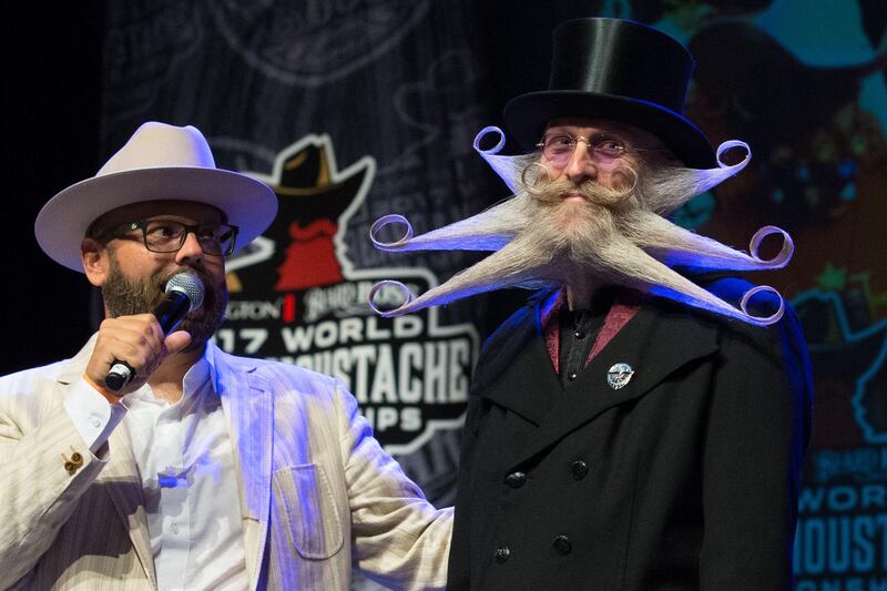 Aarne Bielefeldt, right, is announced as the third place finalist at the 2017 Remington Beard Boss World Beard & Moustache Championships  in Austin, Texas. Suzanne Cordeiro / AFP Photo