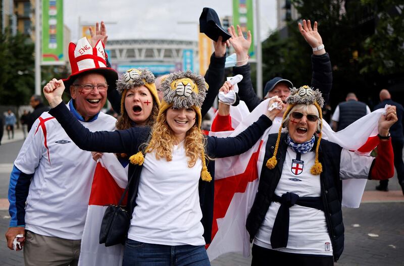 England supporters arrive at Wembley Stadium in west London on June 22, 2021, to watch the UEFA EURO 2020 football match between England and Czech Republic. / AFP / Tolga Akmen
