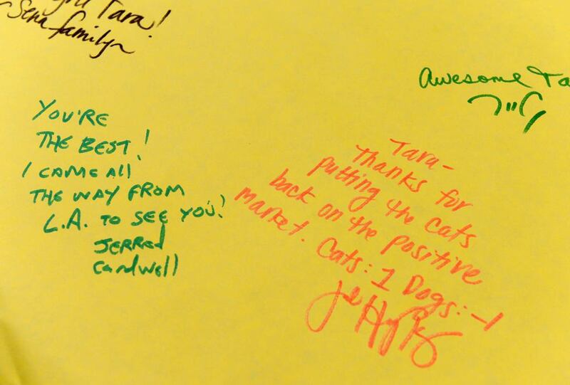 Messages are seen on a greeting card for Tara.