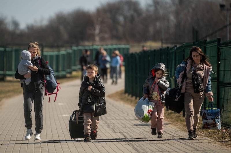 Refugees from Ukraine cross the border at Medyka in south-eastern Poland. AFP