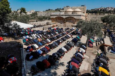 Palestinian Muslim worshippers pray during Friday noon prayers near the Golden Gate (background), also known as the Gate of Mercy, inside the Aqsa mosque compound in the Old City of Jerusalem, on March 8, 2019. The compound is the third-holiest site in Islam and a focus of Palestinian aspirations for statehood, but it is also the location of Judaism's most holy spot, revered as the site of the two biblical-era Jewish temples. Jews are allowed to visit but cannot pray there and it is a frequent scene of conflict between the two sides.
 / AFP / AHMAD GHARABLI
