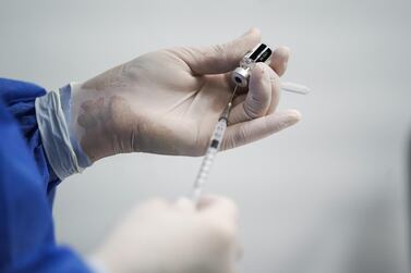 A healthcare worker fills a syringe with a dose of the Pfizer-BioNTech Covid-19 vaccine at The University Hospital of La Samaritana in Zipaquira, Colombia, February 18, 2021. Bloomberg