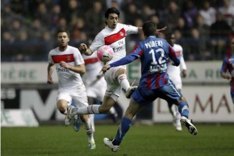 Paris Saint-Germain's Argentinian midfielder Javier Pastore (L) vies for the ball with Caen's French midfielder Gregory Proment (R) during the French L1 football match between Caen and PSG on March 17, 2012 at the Michel D'Ornano Stadium in Caen. AFP PHOTO / CHARLY TRIBALLEAU
