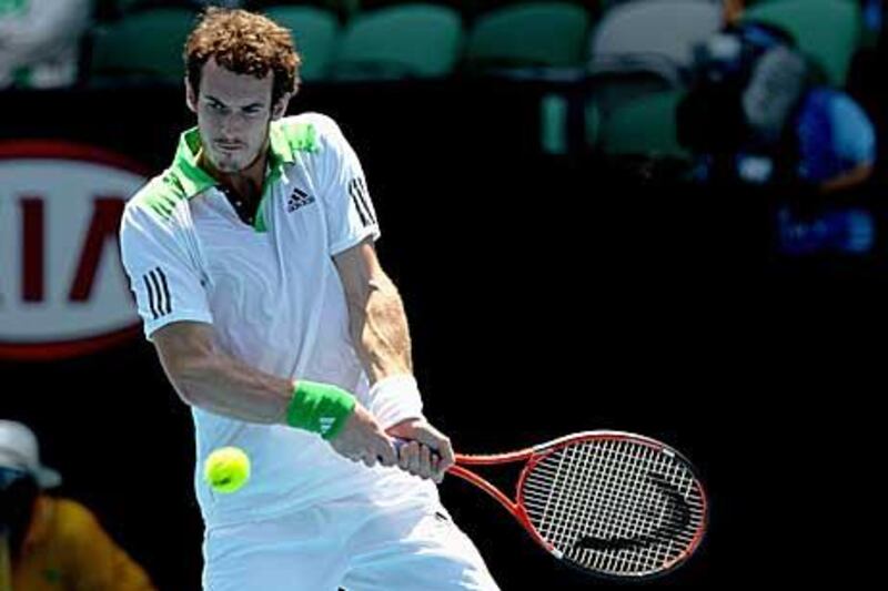 Andy Murray of Great Britain plays a backhand in his third round match against Guillermo Garcia-Lopez of Spain.