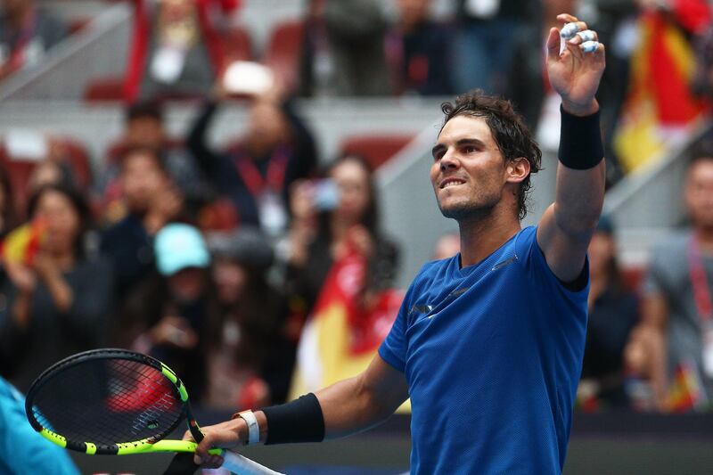 epa06247685 Rafael Nadal of Spain celebrates after defeating John Isner of the USA in their men's singles quarter final match of the China Open tennis tournament at the National Tennis Center in Beijing, China, 06 October 2017.  EPA/WU HONG