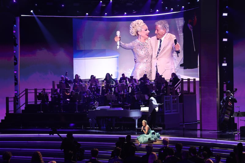 Lady Gaga performs Do I Love You from her album Love for Sale with Tony Bennett. An image of the two singers is displayed above at the Grammy Awards, April 2022. Reuters