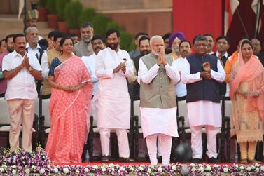 Narendra Modi greets the audience at his swearing-in for a second term as India's prime minister in New Delhi on May 30, 2019. AFP