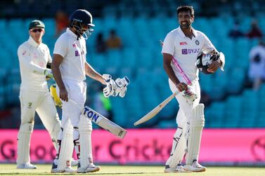 India's Ravichandran Ashwin, right, and Hanuma Vihari walk from the field at close on the final day after a battling draw against Australia. AP