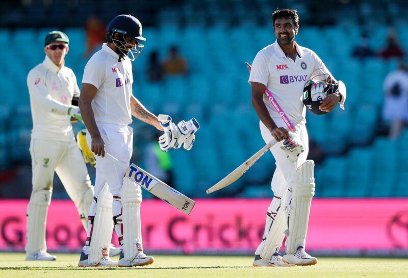 Not out batsman India's Ravichandran Ashwin, right, and Hanuma Vihari walk from the field following play on the final day of the third cricket test between India and Australia at the Sydney Cricket Ground, Sydney, Australia, Monday, Jan. 11, 2021. The test ended in a draw and the series is at 1-1 all with one test to play. (AP Photo/Rick Rycroft)