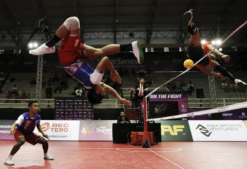 Malaysia’s Khairol Zaman (2nd L) in action against The Philippines’s Rheyjhey Ortouste (R) during their semi final match. Asia Sports Ventures / Action Images via Reuters