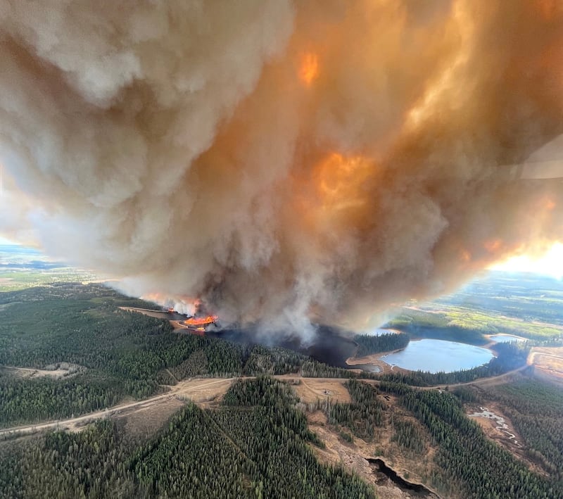 Smoke from wildfire EWF031 near Lodgepole, Alberta, Canada, on Thursday. Reuters