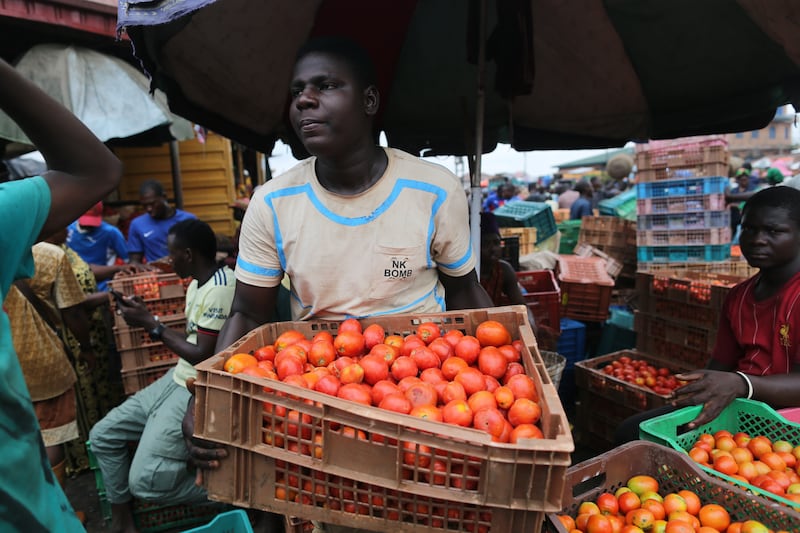 A vendor at the Mile 12 International food market in Lagos, Nigeria. EPA