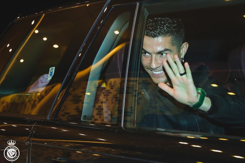 Cristiano Ronaldo waves to supporters.