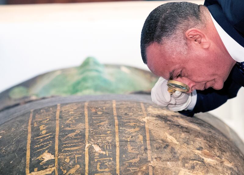 Secretary-General of the Egyptian Supreme Council of Antiquities Mostafa Waziri takes a close look at the ancient Egyptian artefact 'Green Sarcophagus' after it was returned from the Houston Museum of Natural Sciences, in Cairo, Egypt. EPA