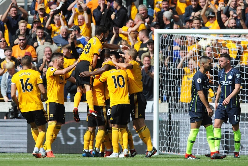 Wolverhampton Wanderers players celebrate after Willy Boly scored the opening goal. AP Photo