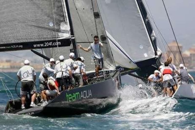 Team Aqua, left, in hot pursuit of a rival yacht in the waters off Valencia.