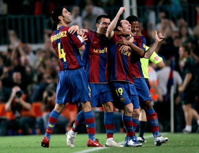 Barcelona's player Leo Messi (2nd R) celebrates with his team mate after scoring against Sevilla during their Spanish First division soccer match at Nou Camp stadium in Barcelona September 22, 2007.  REUTERS/Gustau Nacarino  (SPAIN)