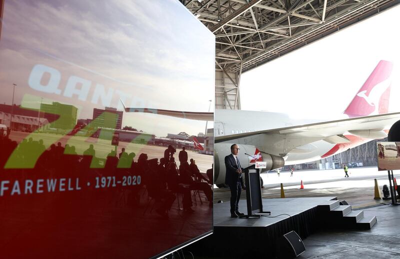 Alan Joyce speaks in front of a Qantas 747 jumbo jet, before its last departure from Sydney Airport. Reuters